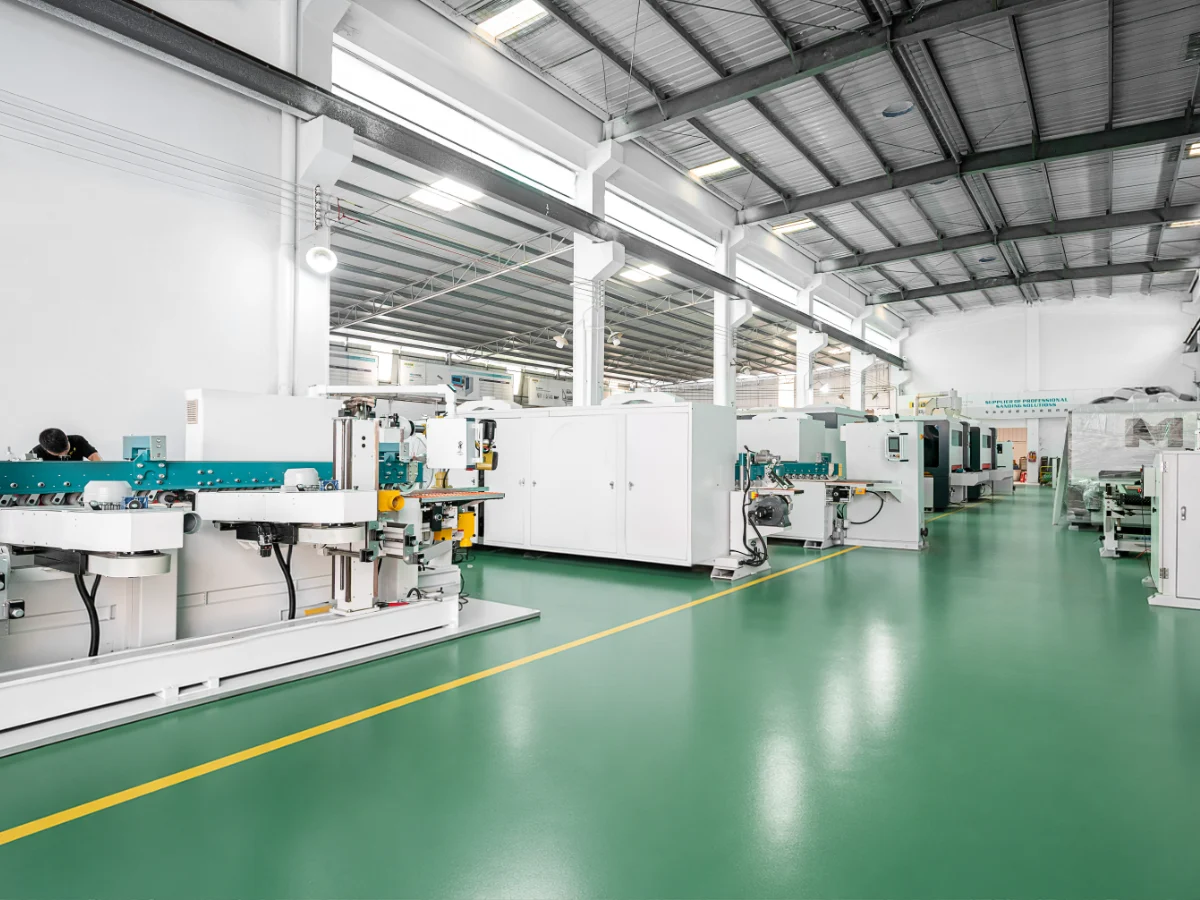 Automated wooden-panel sanding line with feeding conveyor, two profile sanding machines, turnover unit, and collection station arranged in sequence
