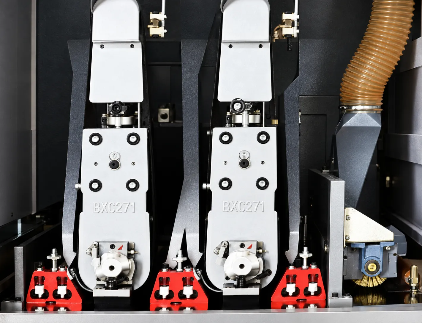 Close-up of BXC271 belt sanding heads and dust extraction inside a primer sander